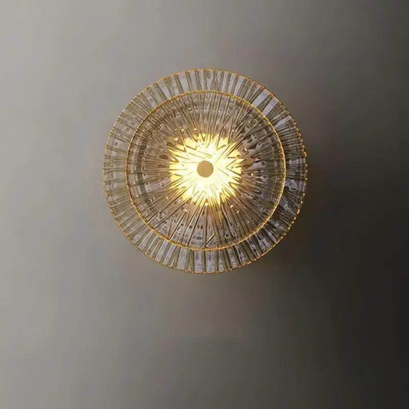 Applique murale dorée ronde en verre