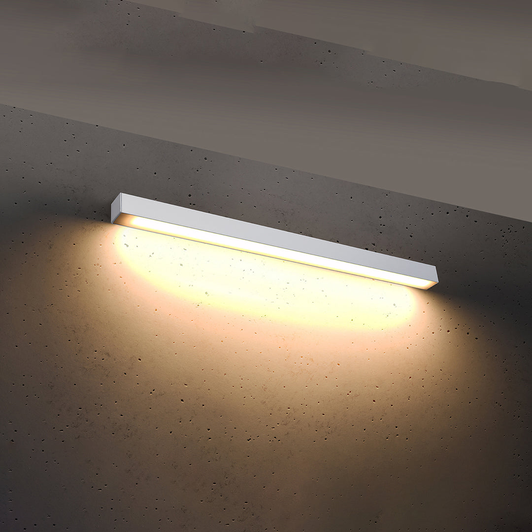 Applique murale linéaire PINNE blanc allumée, lumière vers le bas