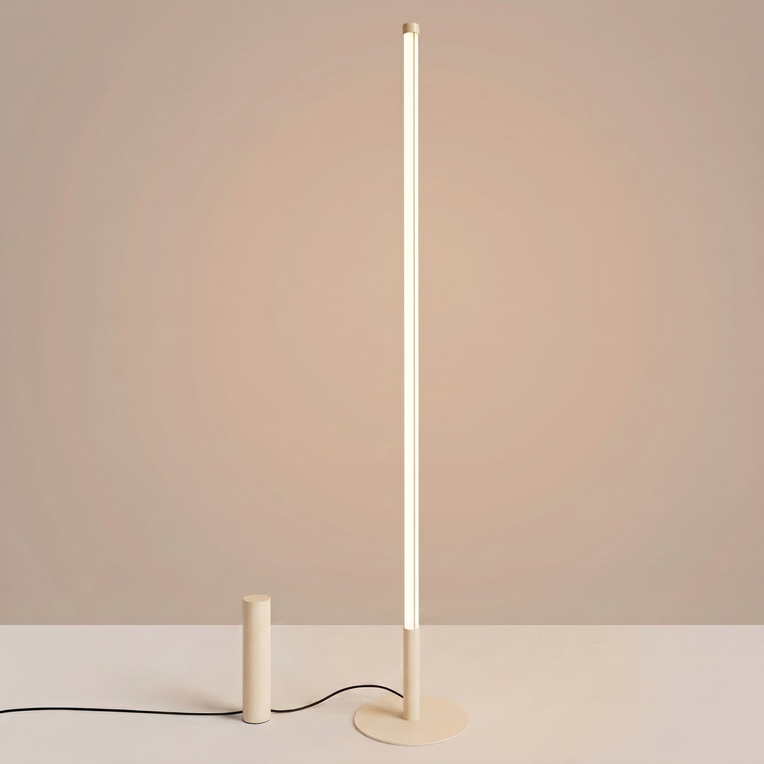 Lampadaire TRANG beige allumée, tube lumineux