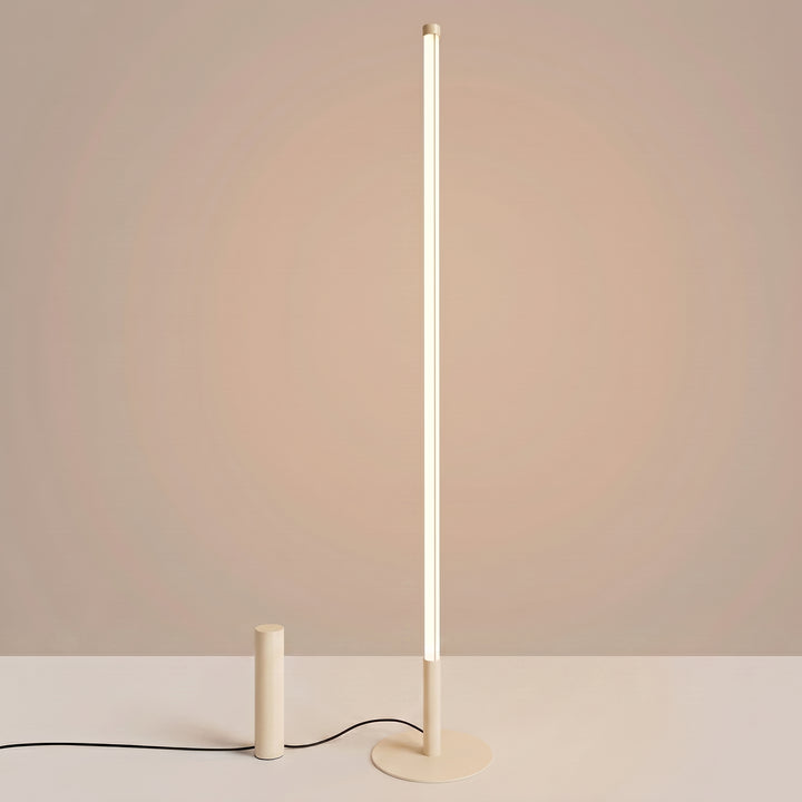 Lampadaire TRANG beige allumée, tube lumineux