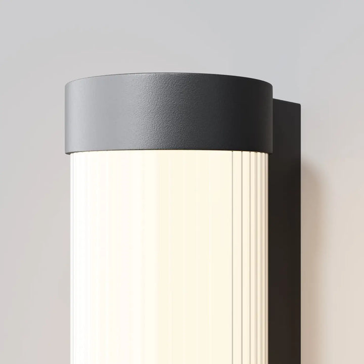 Applique extérieure led ronde en aluminium noir avec diffuseur cylindrique à rainures verticales moderne et élégant