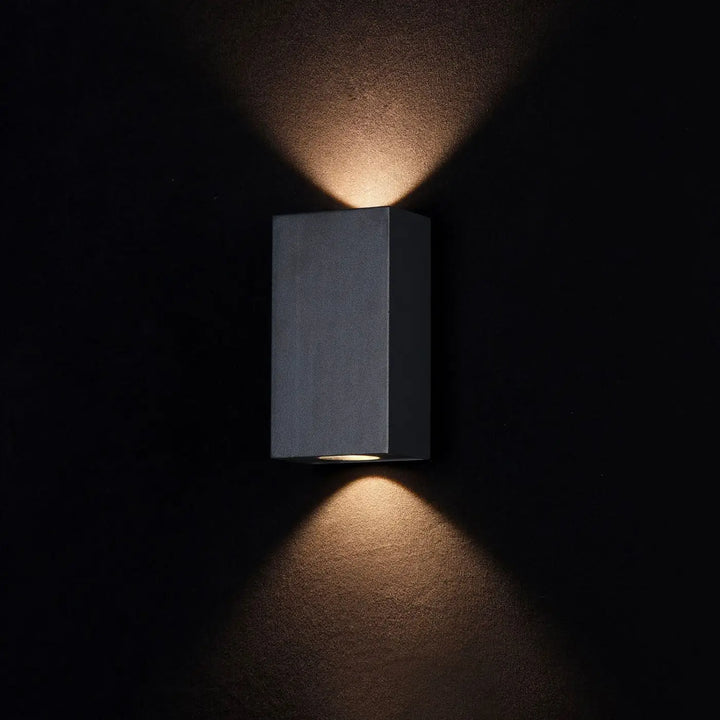 Matte black acier noir rectangular times square wall sconce with dual downward lights providing lumière indirecte
