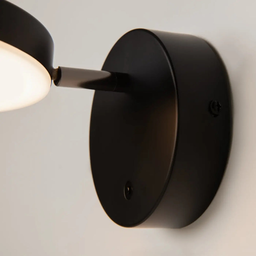 Applique murale fad métal noir avec tête ronde orientable et bras ajustable à lumière douce et arrondie