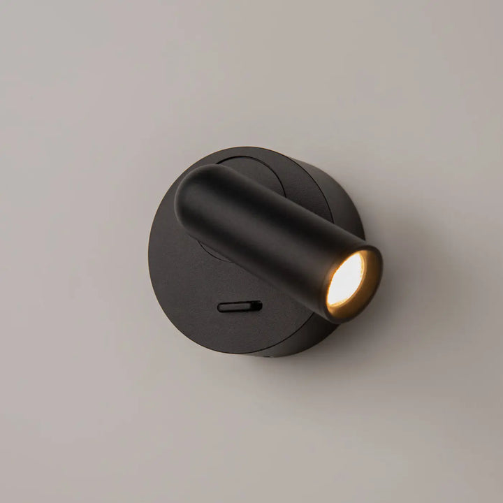 Applique liseuse mirax noire mate avec module rond et tête cylindrique pour lecture avec lumière chaude