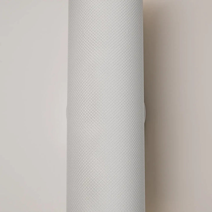Applique murale artisan en forme cylindrique gris clair avec surface texturée pour éclairage d’accent moderne