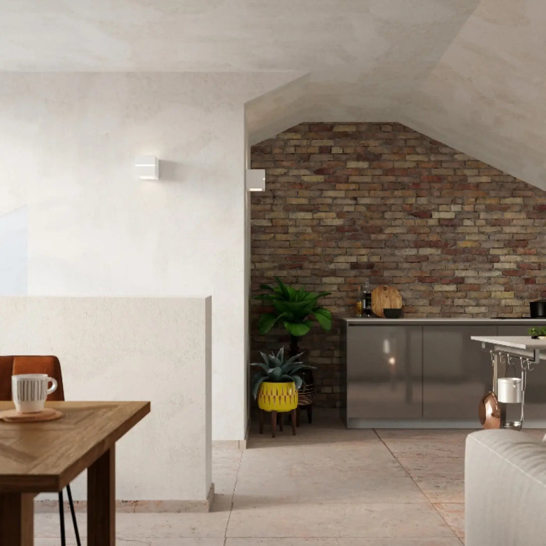 Applique murale céramique leo line dans une cuisine moderne avec murs en brique et belle lumière minimaliste