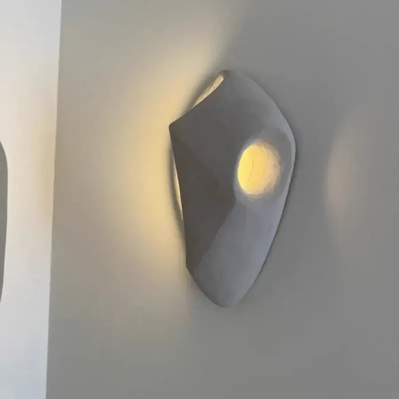 Applique murale cocon en pierre beige

