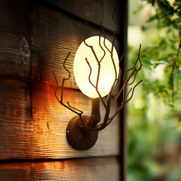 Applique murale design branches en métal et globe lumineux chic