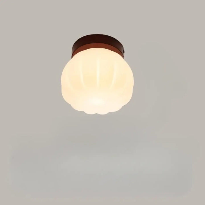 Applique murale puffo en verre dépoli chaud avec base métal brun et abat-jours arrondis au design doux murale