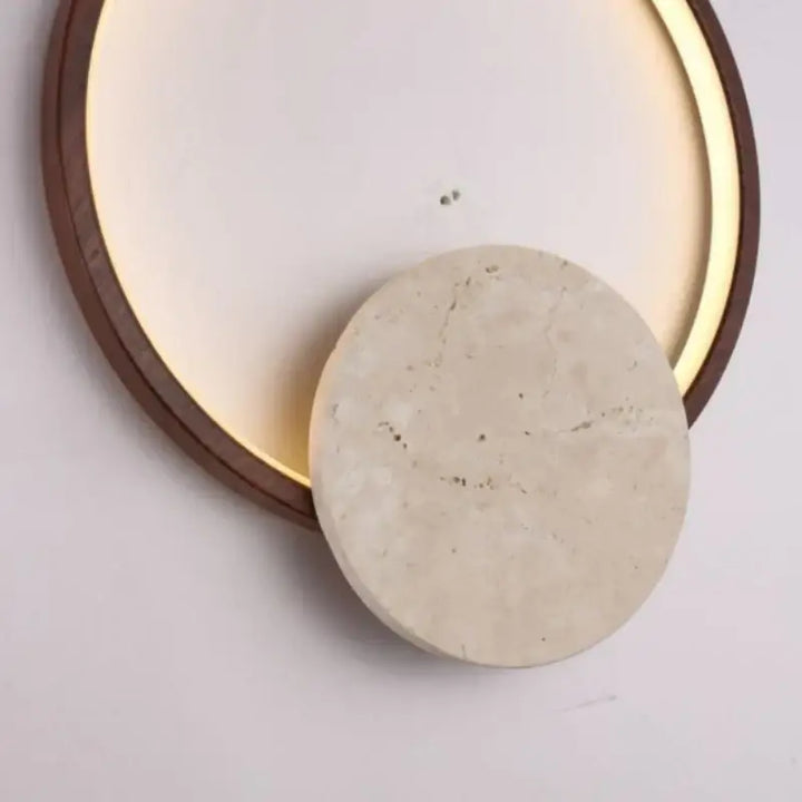Applique murale design ronde pierre et métal design épuré