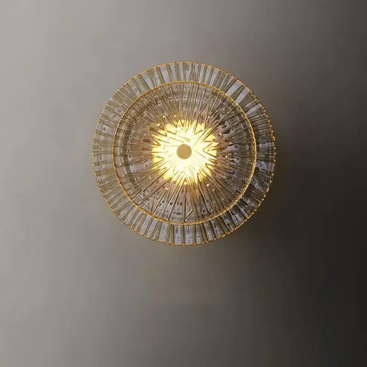 Applique murale dorée ronde en verre

