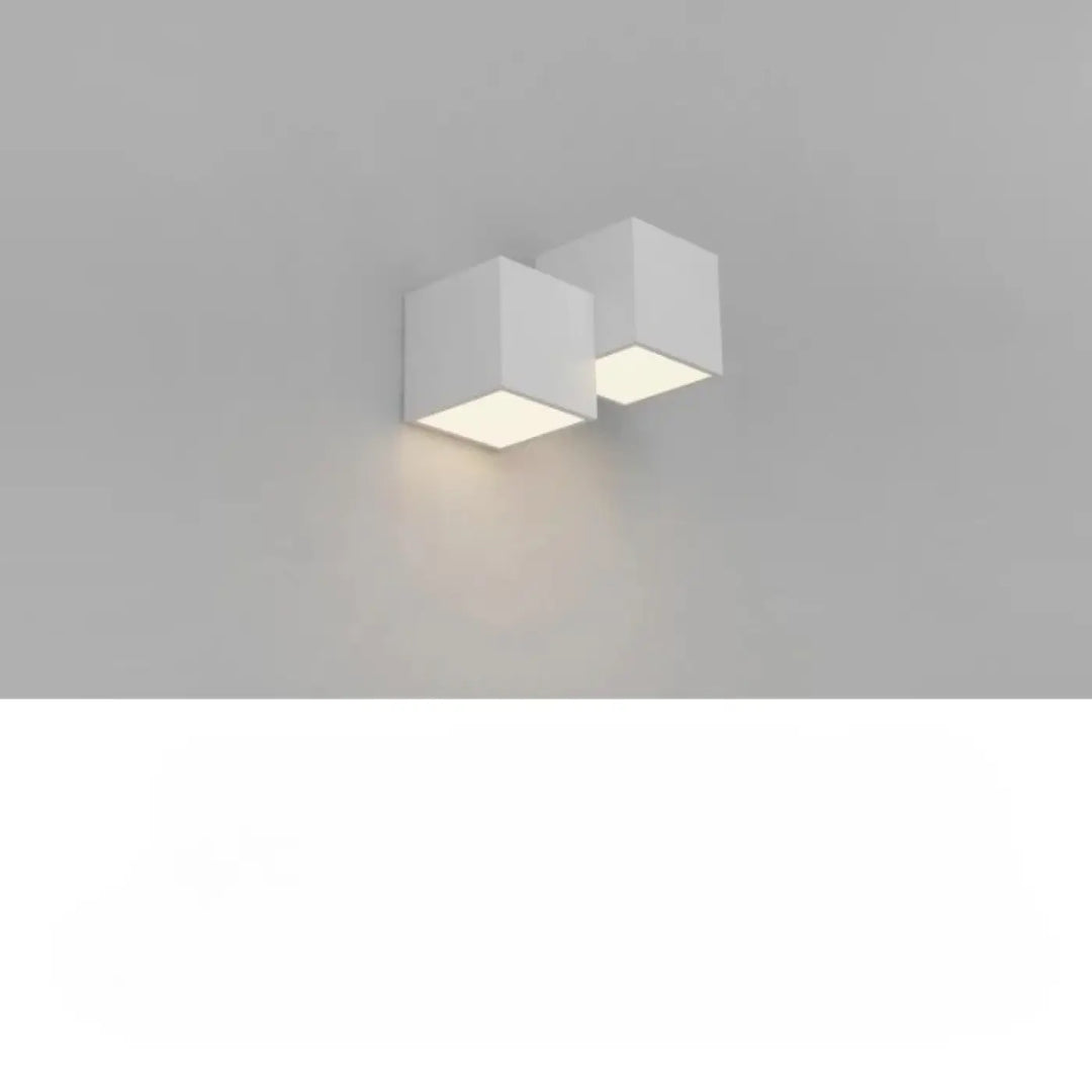 Applique murale kubora minimaliste carrés flottants blancs avec effet lumineux doux et lignes épurées