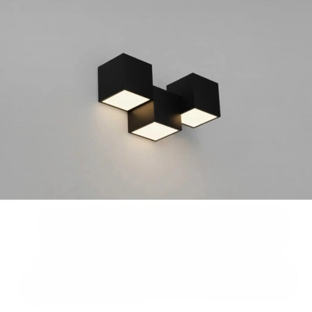 Applique murale kubora en noir avec trois carrés flottants lumineux hexagonaux modernes