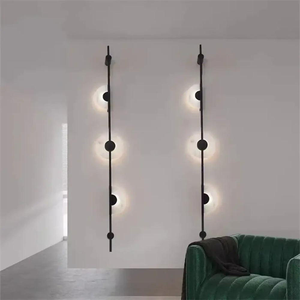 Applique murale discor noire minimaliste avec luminaires circulaires verticaux en métal pour salle à manger