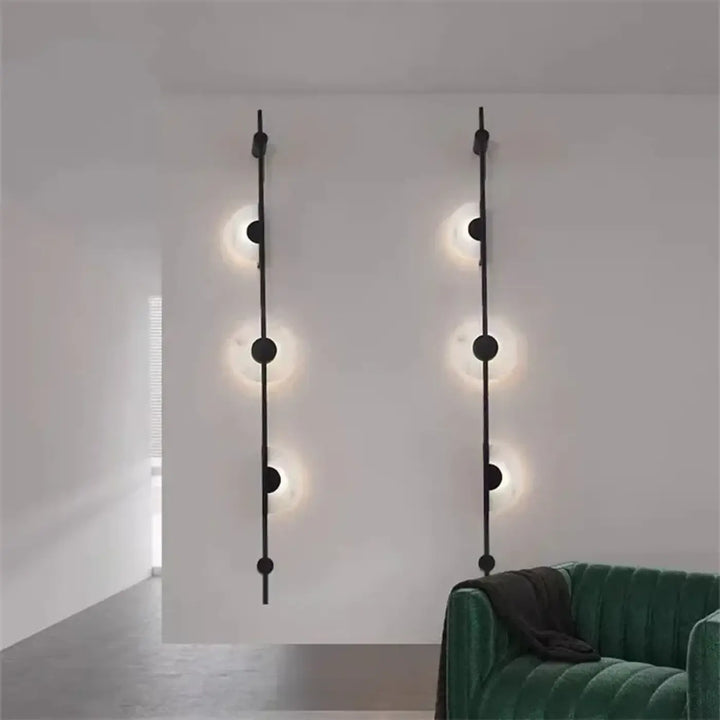 Applique murale discor noire minimaliste avec luminaires circulaires verticaux en métal pour salle à manger