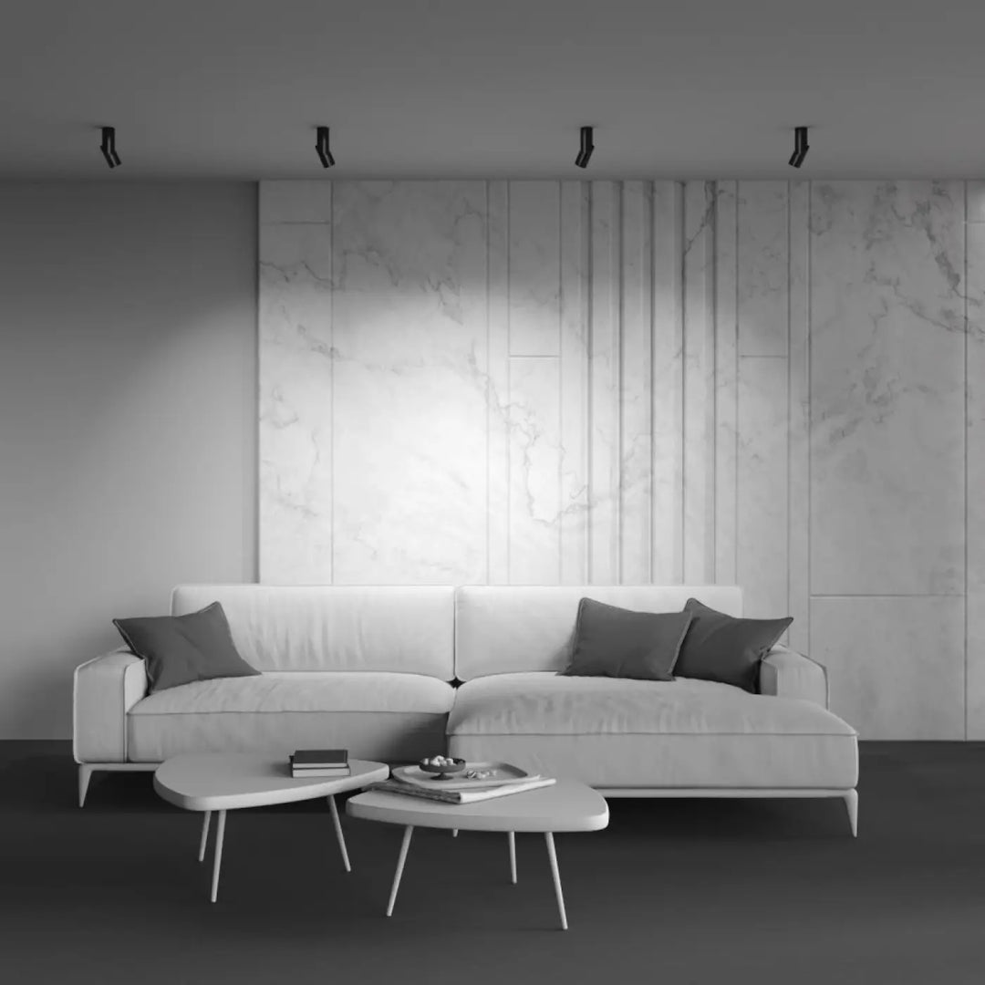 Applique murale profil plié en acier noir avec canapé sectionnel blanc moderne et coussins gris foncé