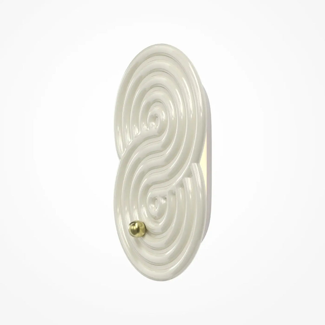 Applique murale led en céramique crème avec design tourbillonnant et accent en laiton pour rock garden