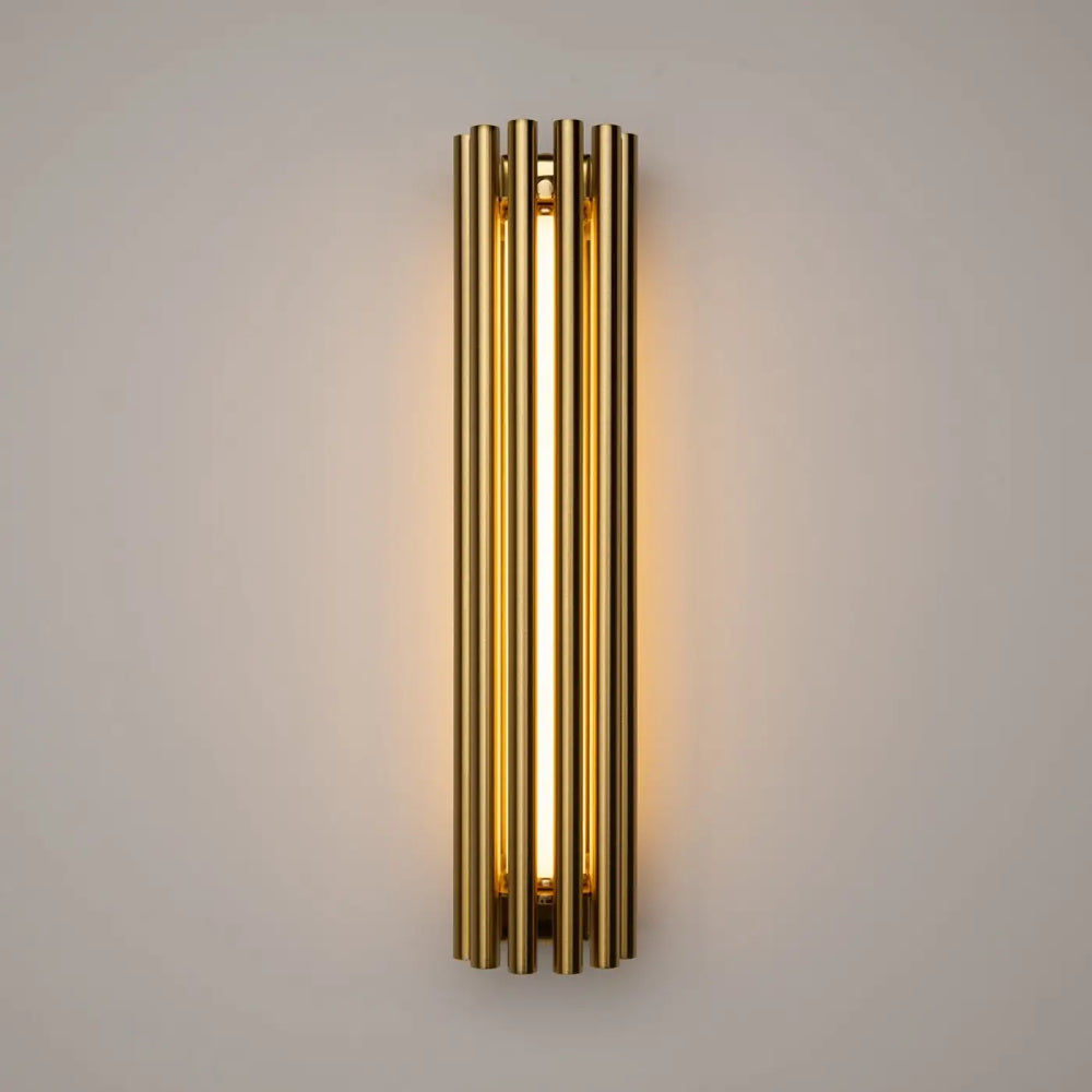 Applique murale sonata cylindre en tons dorés avec tubes cylindriques verticaux et lumière murale led chaleureuse