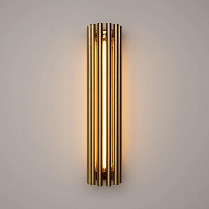 Applique murale sonata cylindre en tons dorés avec tubes cylindriques verticaux et lumière murale led chaleureuse