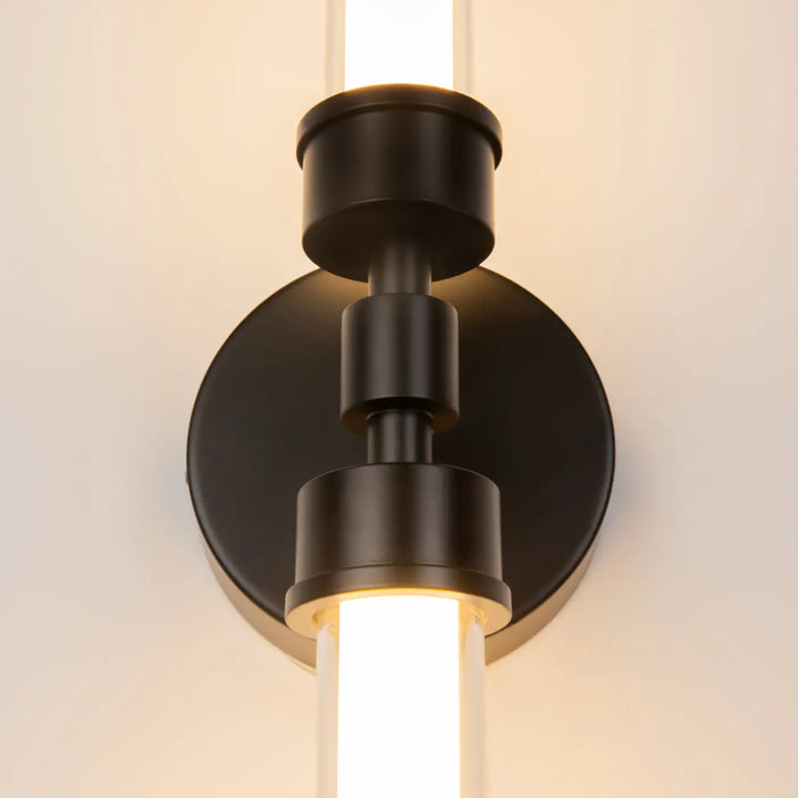 Applique murale led steplo en métal noir mat avec éléments cylindriques empilés et long tube led lumineux vertical