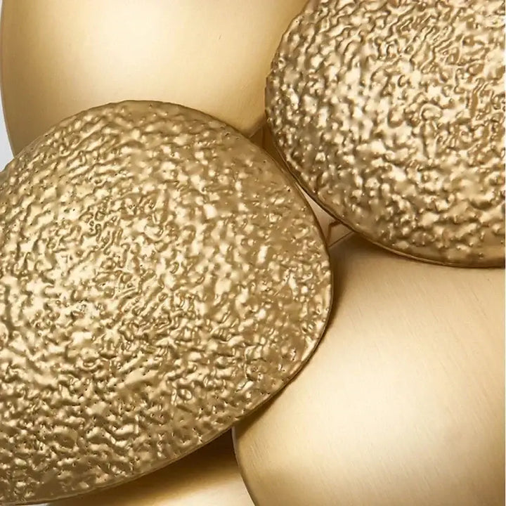 Applique murale luxe formes feuilles dorée au design raffiné