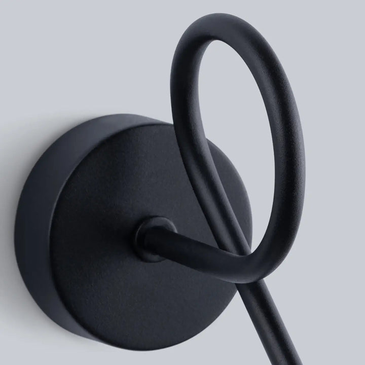 Applique murale série artemis 1s noir en métal mat avec bras courbé pour créer une atmosphère intime