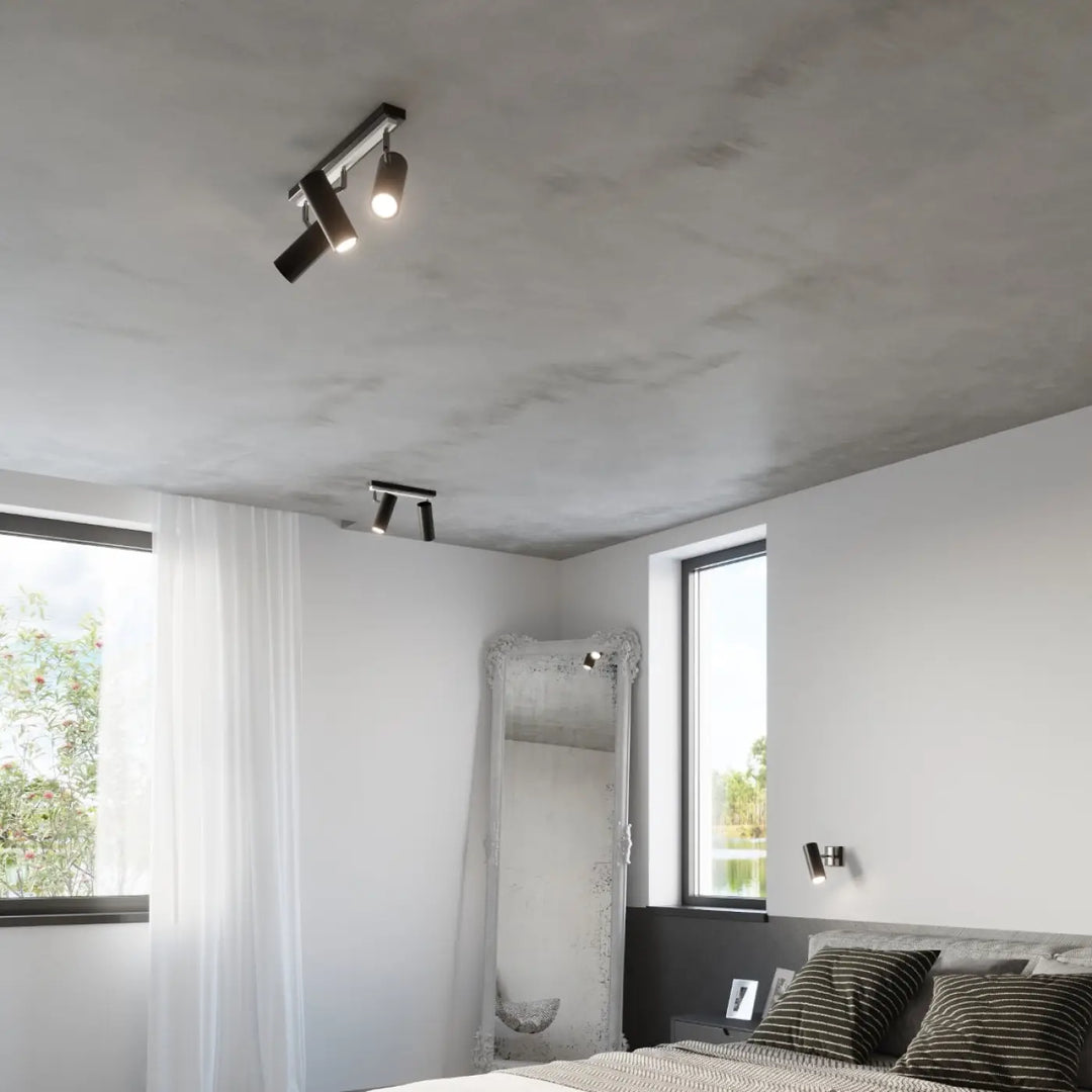 Applique murale minimaliste série direzione en noir avec spots ajustables et éclairage élégant sur plafond texturé
