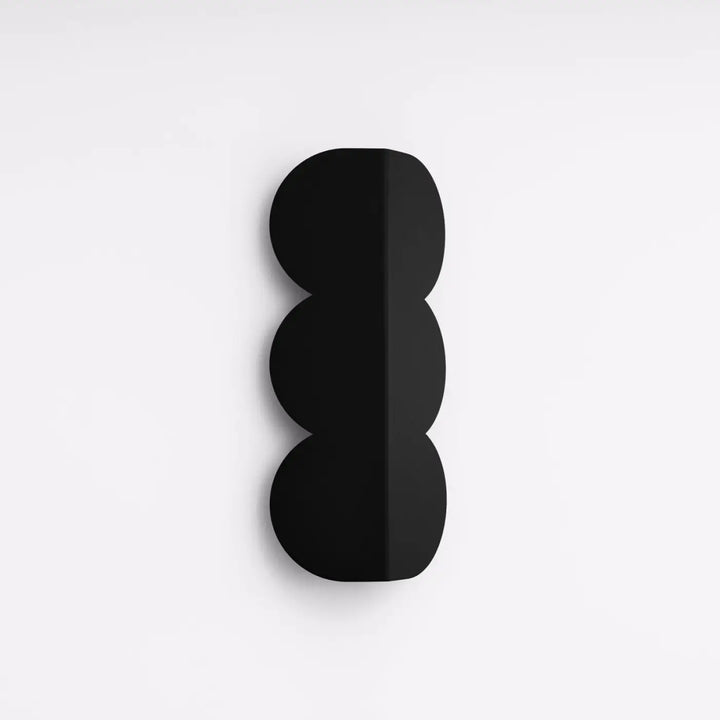 Applique murale BISCUIT noir éteinte, posée au mur