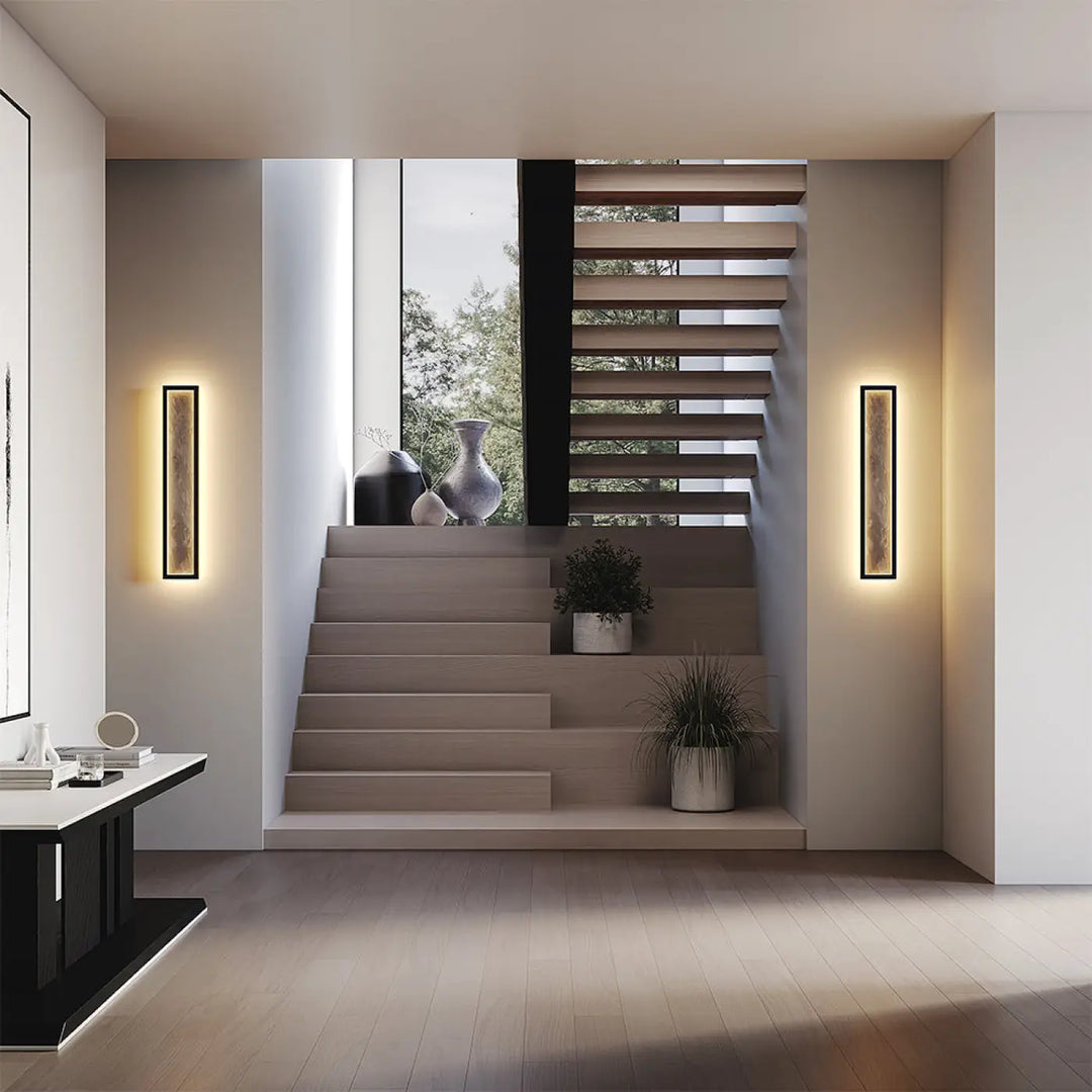 Applique murale orign effet pierre avec cadre noir minimaliste et éclairage led linéaire chaud moderne