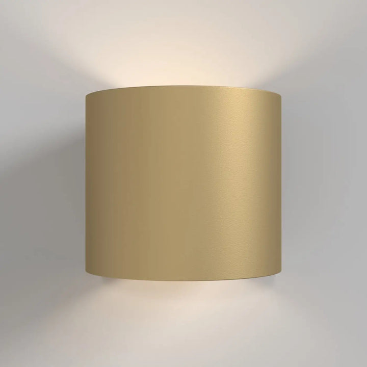 Applique murale rond cylindre en verre doré avec finition tissu texturé pour une lumière douce