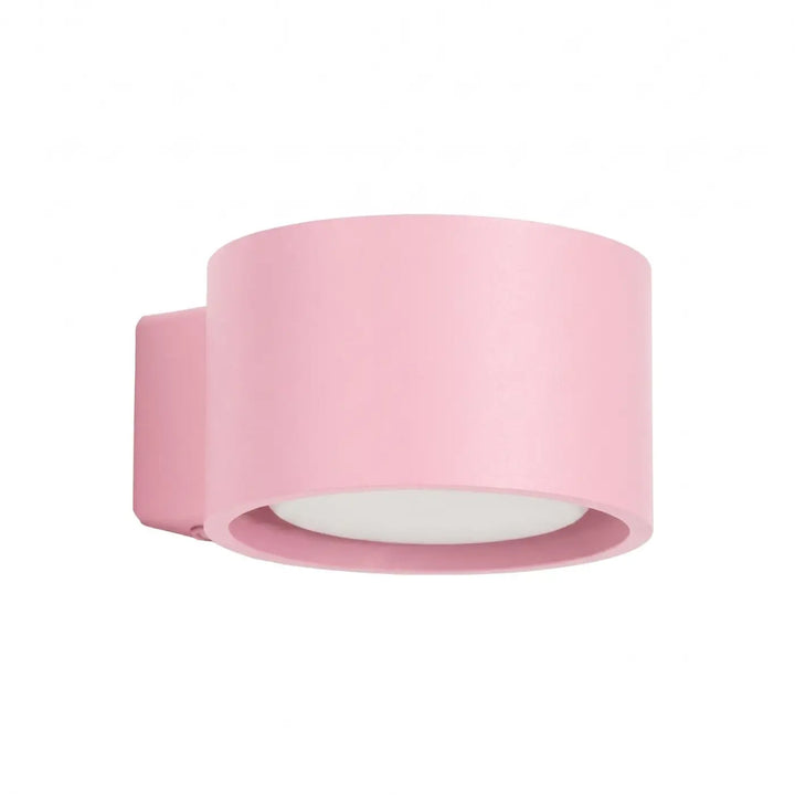 Applique murale ronde rose vue de trois quarts sur fond blanc