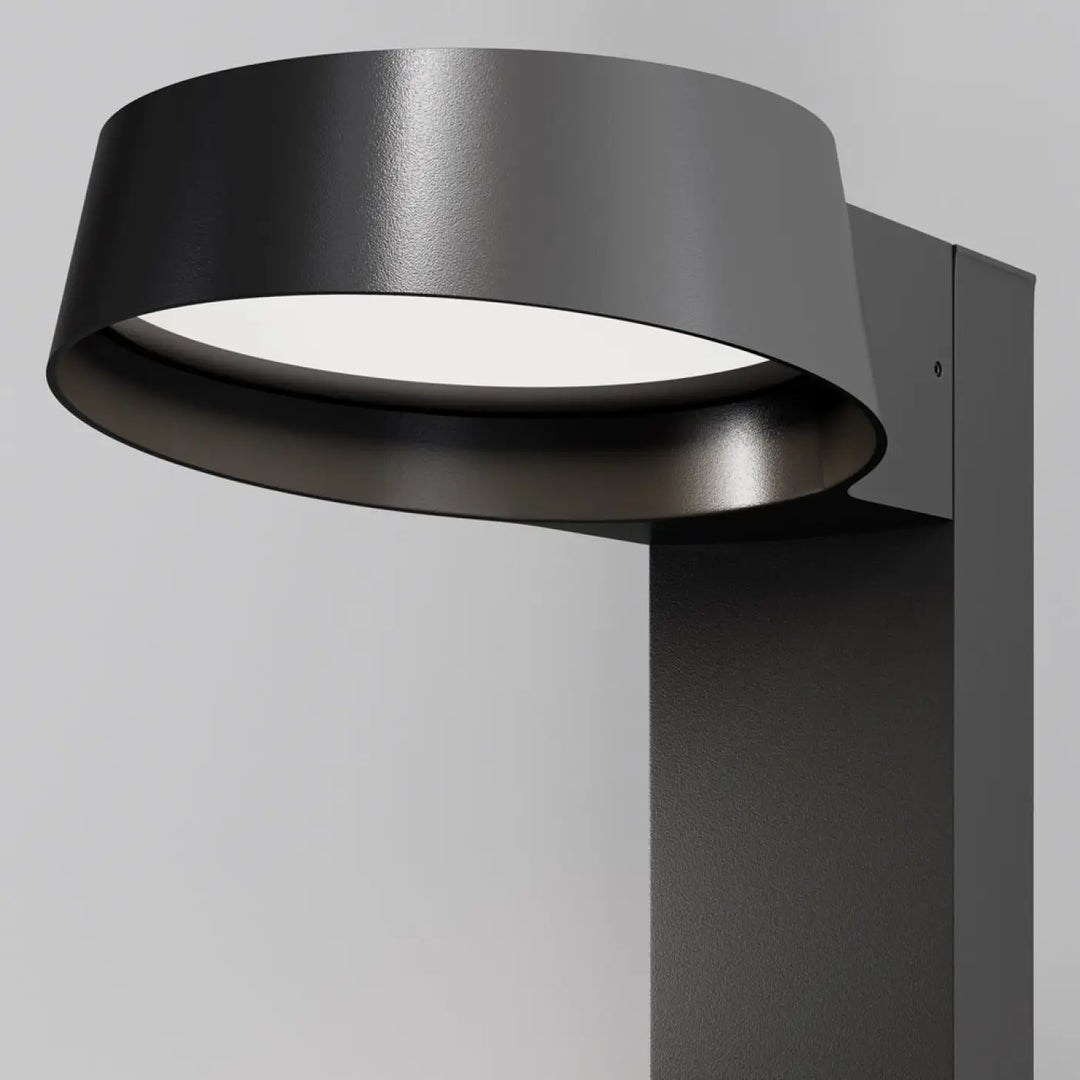 Borne extérieure led noire moderne avec design circulaire et boîtier en métal mat pour utilisation extérieure