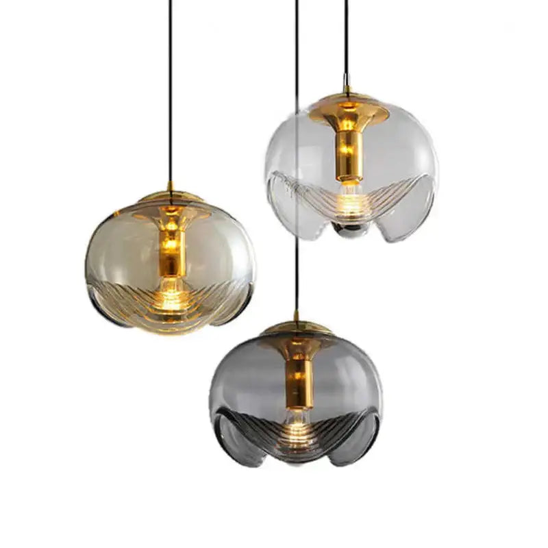 Suspension luminaire design boule en verre doré et noir raffiné
