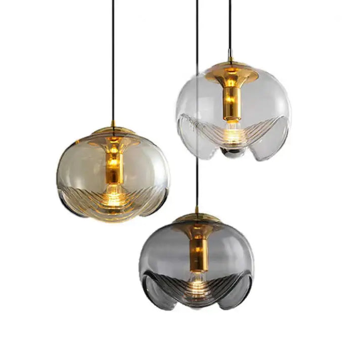 Suspension luminaire design boule en verre doré et noir raffiné