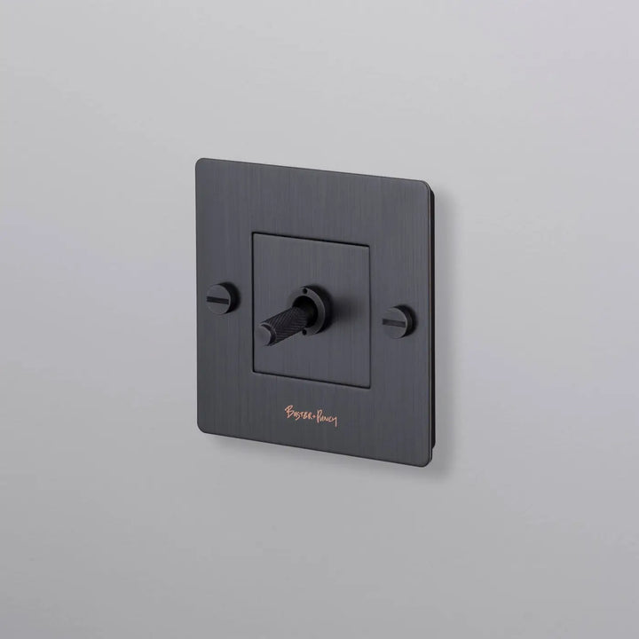 Interrupteur à levier Toggle à gravure quadrillée bronze fumé #couleur_gris