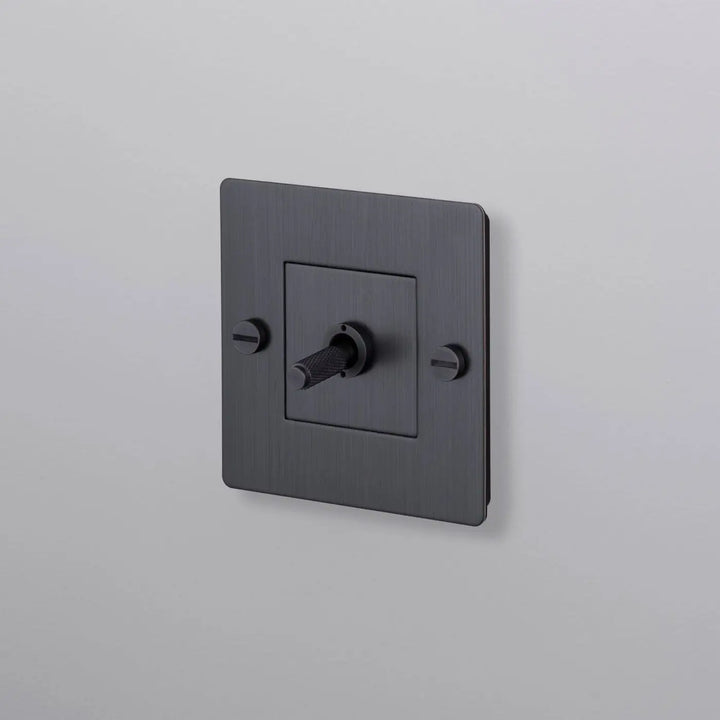 Interrupteur à levier Toggle à gravure quadrillée sans logo bronze fumé #couleur_gris