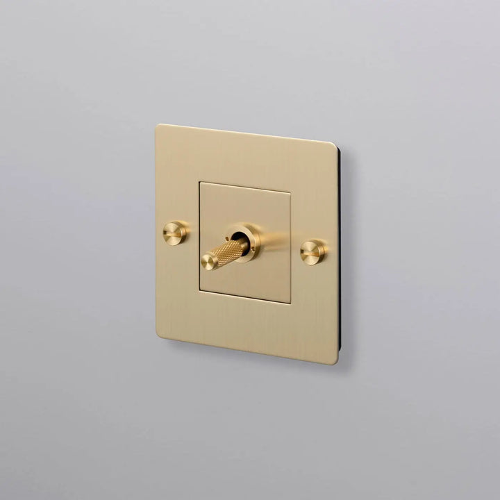 Interrupteur à levier Toggle à gravure quadrillée sans logo doré, finition laiton #couleur_dor