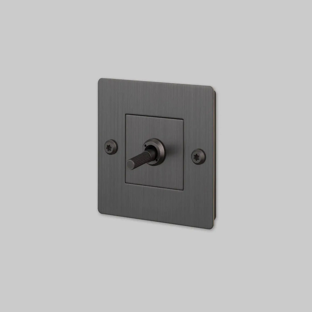 Interrupteur à levier Toggle à gravure alignée sans logo bronze fumé #couleur_gris