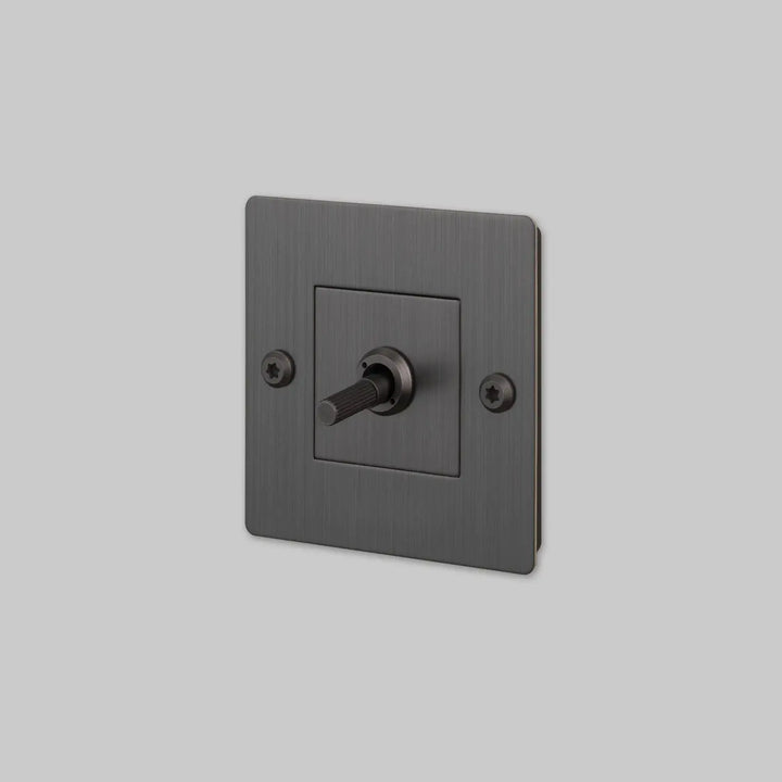 Interrupteur à levier Toggle à gravure alignée sans logo bronze fumé #couleur_gris