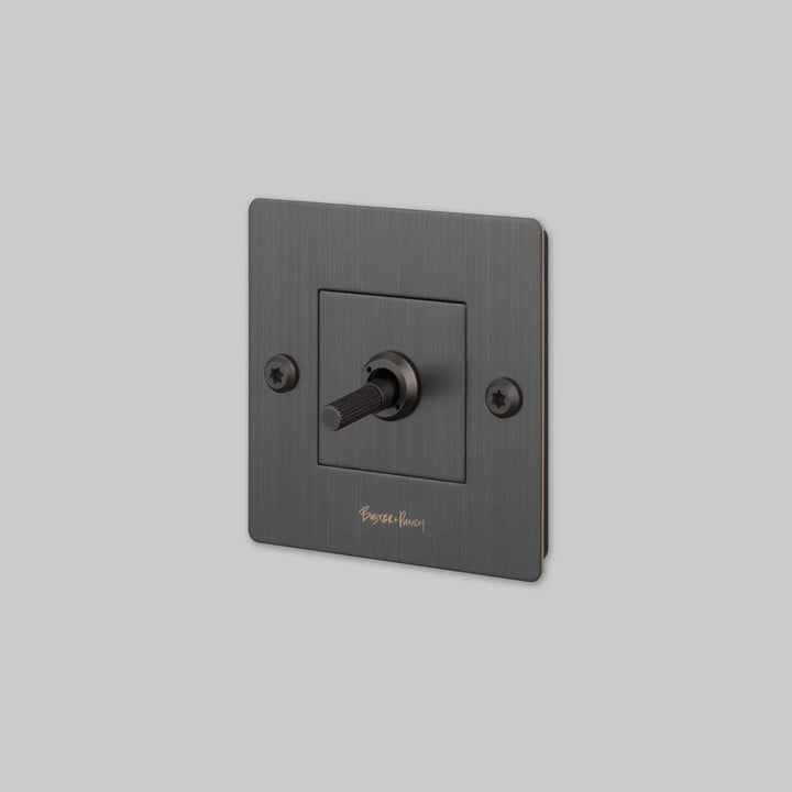 Interrupteur à levier Toggle à gravure alignée avec logo bronze fumé #couleur_gris