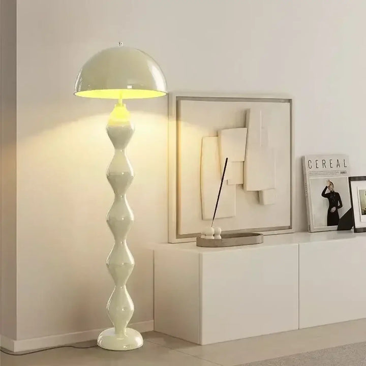 Cream-colored glossy ceramic floor lamp ariha with dome shade and stacked geometric fer type base