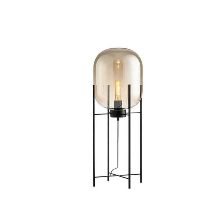 Lampadaire vito avec cadre metal noir et globe verre ambre translucide créant un effet abat-jour ambre élégant