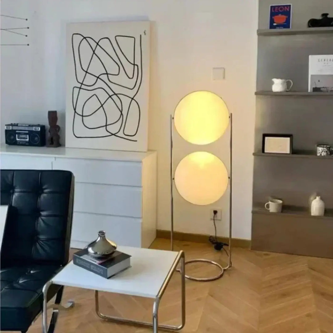 Lampadaire isandy moderne avec deux abat-jours circulaires lumineux et structure métallique fine argentée