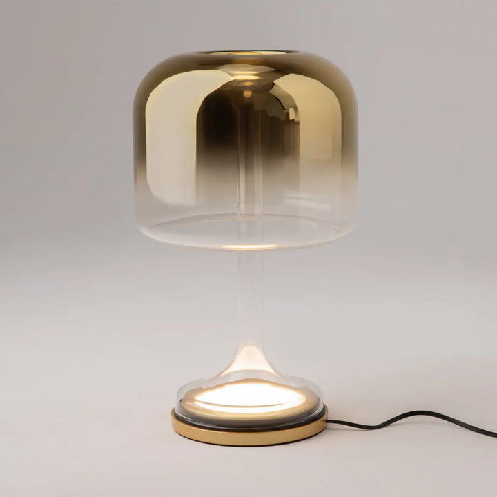 Lampe de chevet spirito avec globe en verre gris dégradé or clair et socle vertical en laiton élégant et moderne