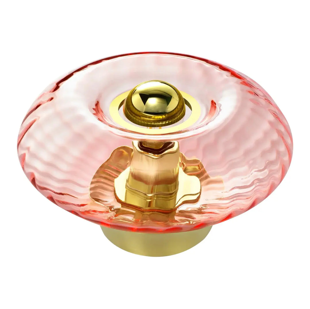 Lampe de chevet grace avec bouton en verre soufflé rose texturé et centre en métal doré poli de la collection grace