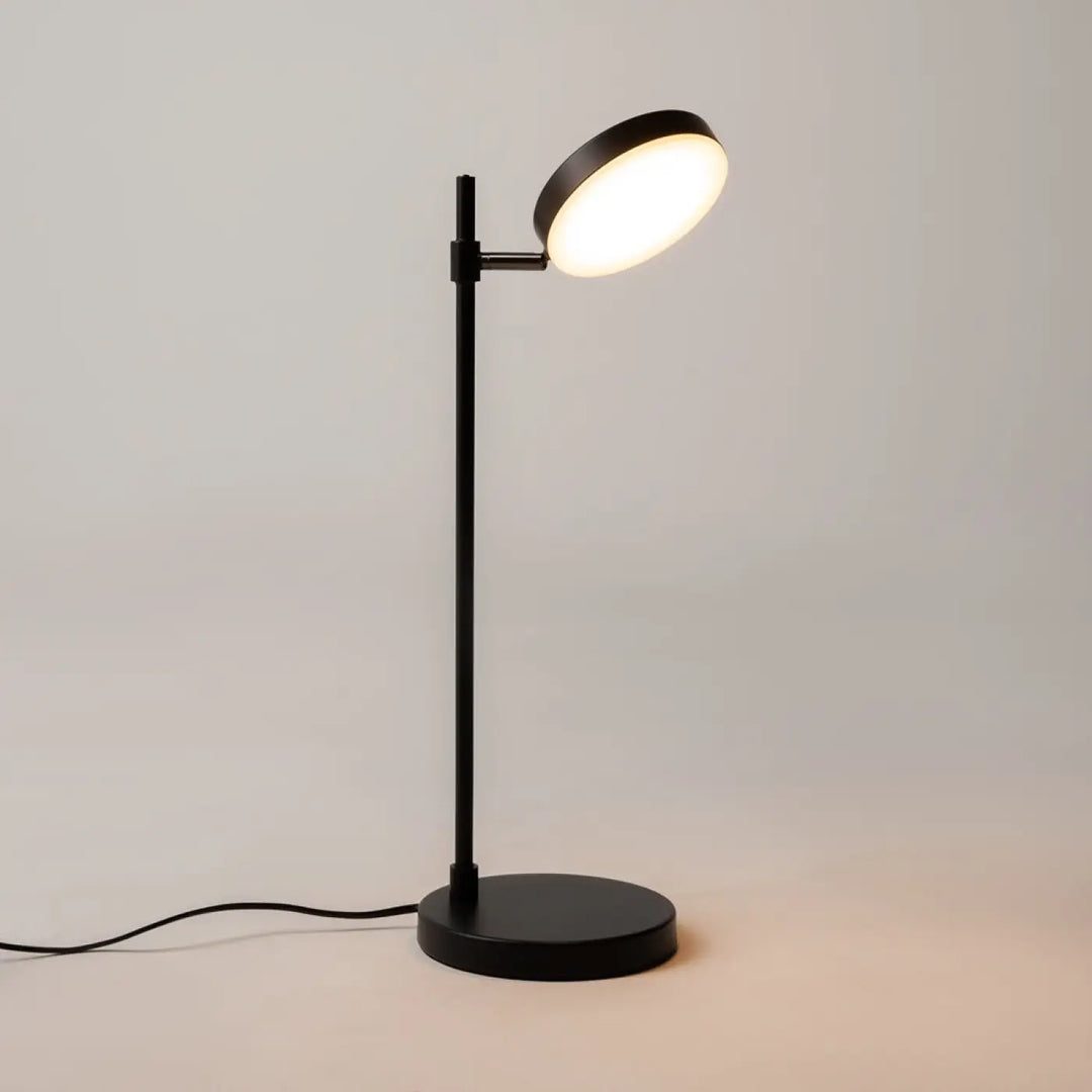 Lampe de chevet fad métal noir avec tête ronde orientable et tige métallique fine au design minimaliste