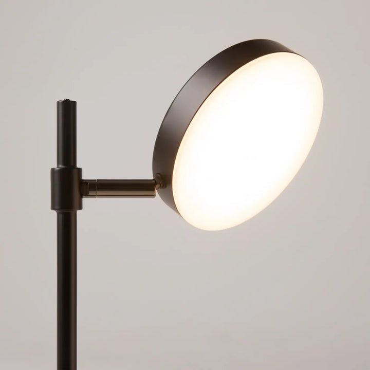 Lampe de chevet en métal noir avec tête ronde orientable et abat-jour circulaire lumineux blanc doux