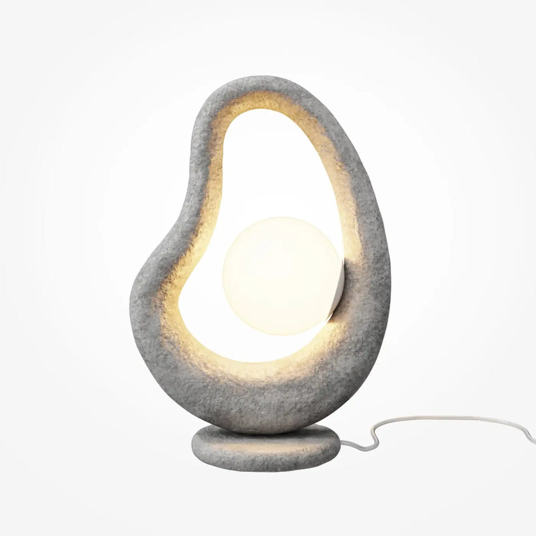 Lampe à poser grise socle sculptural en pierre avec cadre ovale organique et bulbe circulaire lumineux opuS wabi-sabi