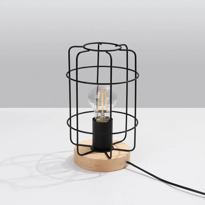 Lampe de table série gotto avec cage en fil noir, base en bois et ampoule à filament pour style loft