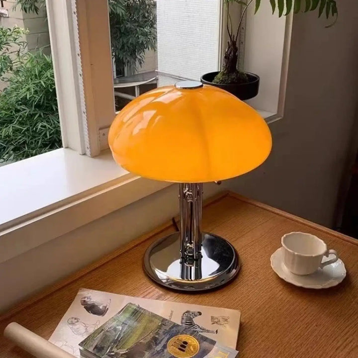 Lampe de table vintage orange en verre avec pied chrome